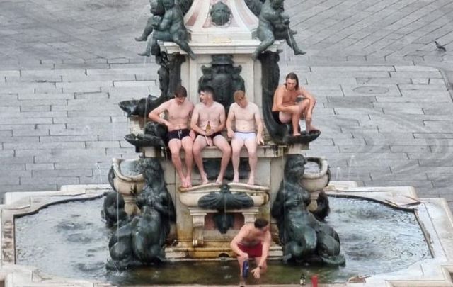 The Irish tourists were quickly apprehended and fined for scaling the Neptune Fountain in Bologna, Italy.