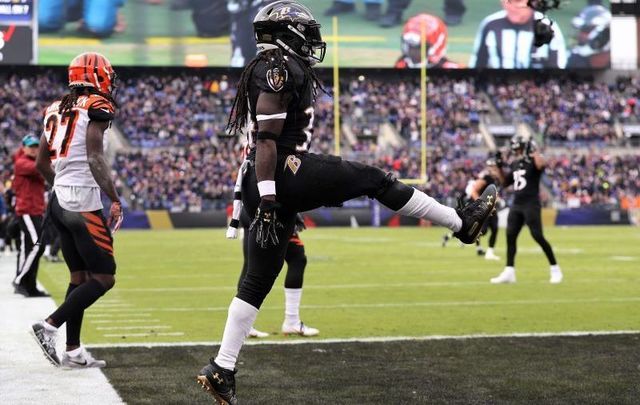 November 18, 2018: Alex Collins, then playing for the Baltimore Ravens, celebrates with some Irish dancing after scoring a touchdown against the Cincinnati Bengals at M&T Bank Stadium in Baltimore, Maryland. 