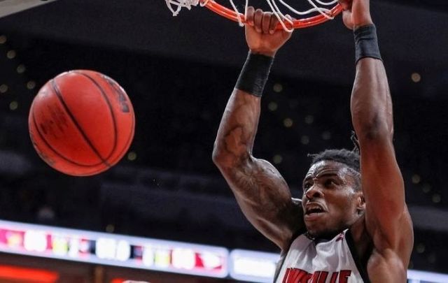 November 17, 2019: Aidan Igiehon, #22 of the Louisville Cardinals, dunks the ball during the second half against the North Carolina Central Eagles at KFC YUM! Center in Louisville, Kentucky. 