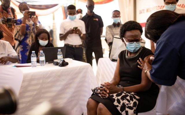 Residents in Kampala, Uganda line up for their COVID-19 vaccine. 