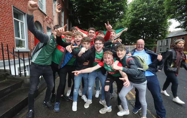 August 14, 2021: A group of Mayo fans gets photobombed by a Dublin supporter at Croke Park in Dublin ahead of the men\'s and women’s GAA football semi-finals.