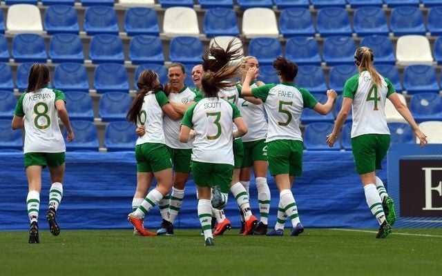 The Irish senior women\'s team celebrate with captain Katie McCabe after she scores against Italy in an international friendly in 2019. 