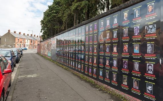 A memorial wall along Beechmount Avenue in Belfast, dedicated to Catholics killed during the Troubles. A sign on the wall states that it is \"dedicated to the families who have fought and are still fighting for truth and justice for their loved ones. It is also dedicated to all those who have died as a result of state-sponsored killings.\"