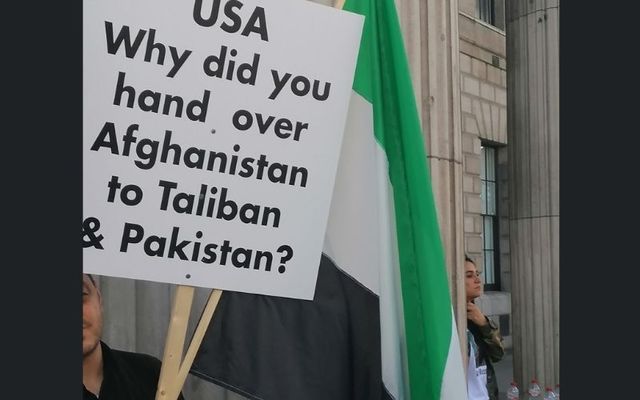 A protester holds up a banner at Sunday\'s protest at the GPO. 