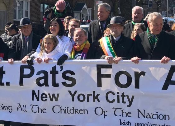 Brendan Fay, center, taking part in a St. Pat’s for All march that included Mayor Bill de Blasio, standing behind, and Senator Charles Schumer, far right.