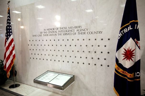 The Memorial Wall and the \"Book of Honor\" are seen in the lobby of the Original Headquarters Building at the Central Intelligence Agency headquarters on February 19, 2009 in McLean, Virginia. The stars on the wall represent the number of CIA officers who have lost their lives for the country.