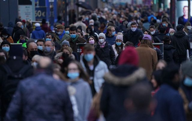 Mask up! A busy train station during a time of Covid.