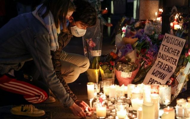 Mourners lay candles outside Dáil Eireann on Friday evening. 