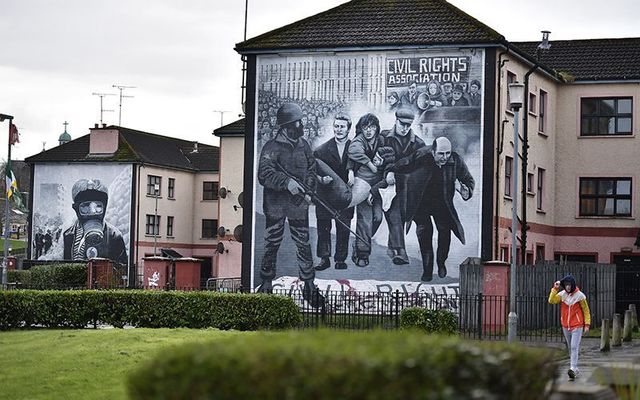 A Bloody Sunday mural in the Bogside depicting Fr. Edward Daly waving a white handkerchief as marchers carry the body of 17-year-old Jackie Duddy. 