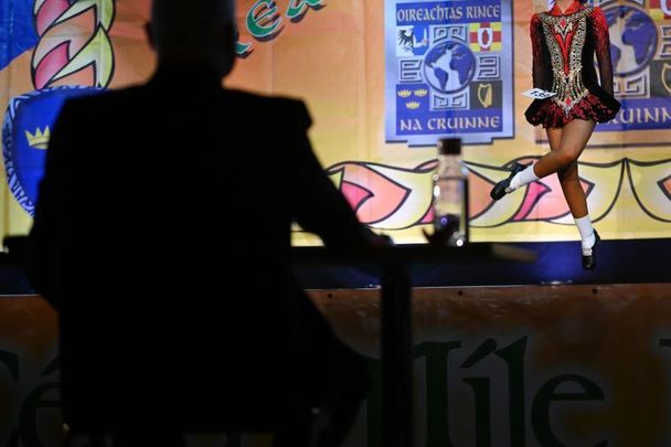 April 10, 2022: A judge watches a competitor during the opening day of the World Irish Dancing Championships at the Waterfront Hall in Belfast, Northern Ireland.