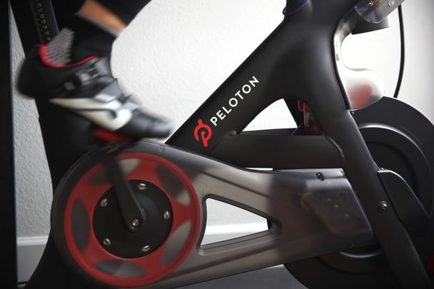 A person riding her at-home Peloton bike in April 2020.