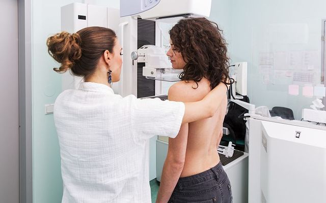 A person receiving a mammogram. Prof Donald McDonnell highlighted the importance of early detection of breast cancer.