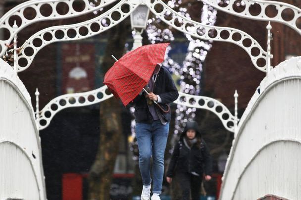 January 13, 2020: A person on the Ha’penny Bridge in Dublin as Storm Brendan hits Ireland. 