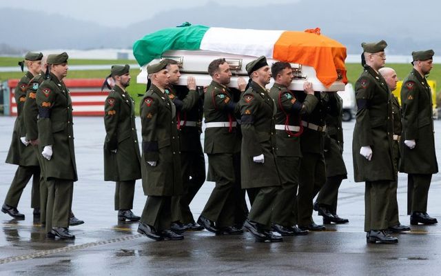 December 19, 2022: The Irish Defence Forces carry the coffin of Pte Seán Rooney on the repatriation to Casement Aerodrome, Baldonnel.