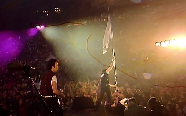 U2 frontman Bono holds a white flag aloft during the group\'s performance of Sunday Bloody Sunday at the Red Rocks Amphitheater in Colorado in 1983. 