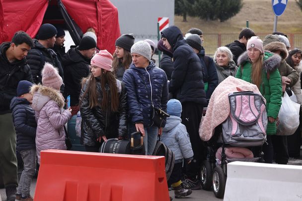 March 2, 2022: People fleeing war-torn Ukraine wait to cross into Poland.