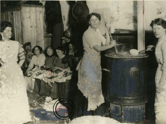 Kitchen in the basement of Liberty Hall; Countess Markievicz is pictured stirring a pot of soup.