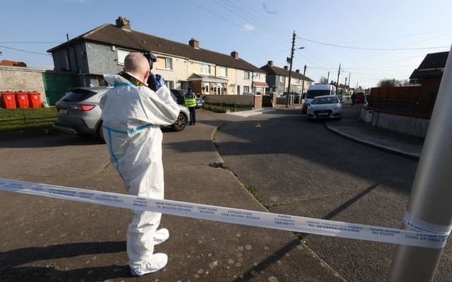 Gardai and forensics at the scene in Collins Place Finglas, Dublin, where a woman was shot dead last night.