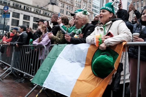 March 17, 2022:  People cheer as marching bands participate in the St. Patrick\'s Day Parade down 5th Ave in New York City. Known as the world\'s largest St. Patrick\'s Day Parade, New York welcomed back the annual event after holding a virtual event last year due to the Covid-19 pandemic. Dozens of bands, performers politicians, and other groups made their way up Fifth Avenue in a celebration of Irish heritage.