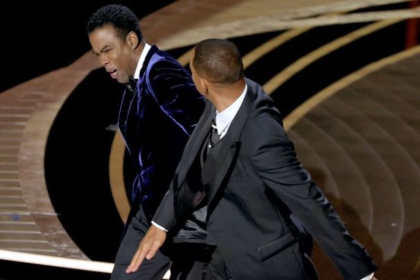 Will Smith smacking Chris Rock during the Oscar\'s ceremony. 