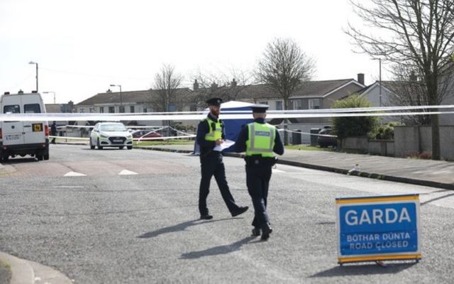 Gardaí at the murder scene on Sunday morning. 