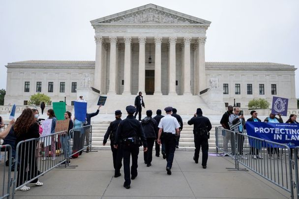 May 3, 2022: U.S. Supreme Court Police officers set up barricades on the sidewalk as pro-choice and anti-abortion activists demonstrate in front of the U.S. Supreme Court Building in Washington, DC. In a leaked initial draft majority opinion obtained by Politico, Supreme Court Justice Samuel Alito allegedly wrote that the cases Roe v. Wade and Planned Parenthood of Southeastern Pennsylvania v. Casey should be overturned, which would end federal protection of abortion rights across the country.