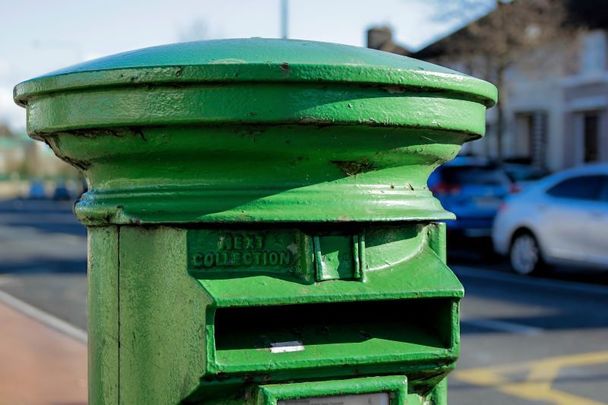 A green post box in Dublin, Ireland. Several Royal Mail post boxes in England have been painted green in recent days.