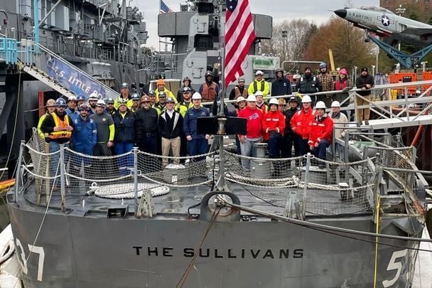 Some of the crew that helped repair the USS The Sullivans at Buffalo and Erie County Naval and Military Park in upstate New York.
