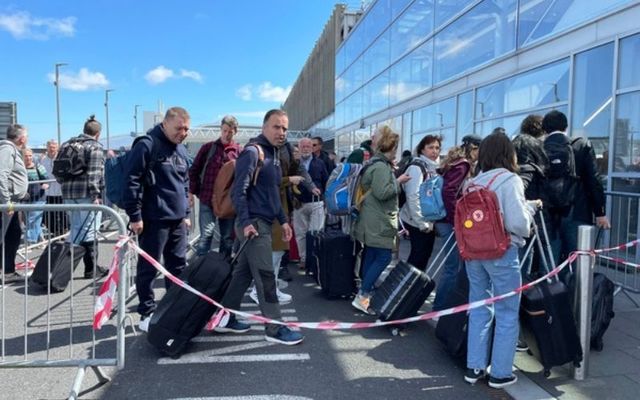 Passengers queue to enter Dublin Airport on Sunday. 
