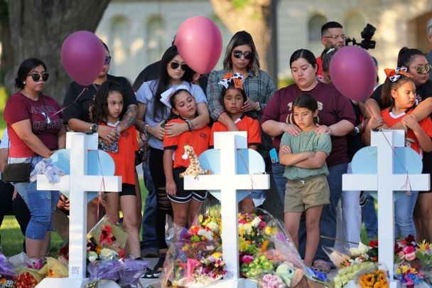 May 26, 2022: People visit memorials for victims of the mass shooting at Robb Elementary School in Uvalde, Texas. 19 children and two adults were killed after a man entered the school through an unlocked door and barricaded himself in a classroom where the victims were located. 