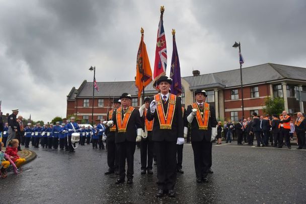 July 13, 2015: The lead Orange party await their signal to begin marching the Twelfth of July parade in Belfast, Northern Ireland. The Twelfth is an Ulster Protestant celebration held annually. It celebrates the victory of Protestant King William of Orange over Catholic King James II at the Battle of the Boyne in 1690.