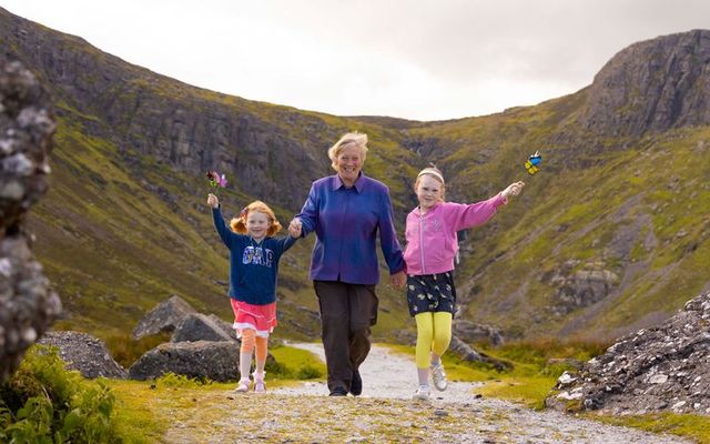 Pictured in the Comeragh Mountains are TV and radio broadcaster and biologist, Eanna Ni Lamhna, along with sisters, Ella Whelan, 9, and Robyn Whelan, 6. 