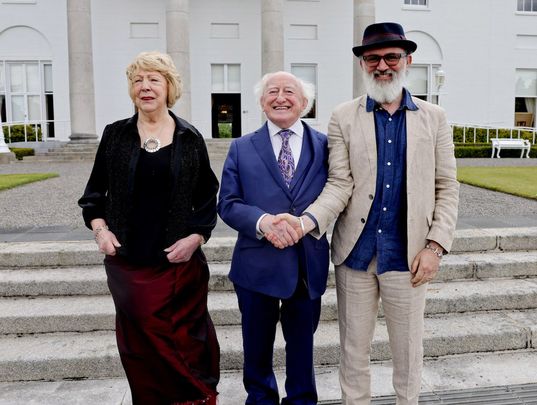 Ireland\'s first lady Sabina, President Michael D Higgins and Tommy Tiernan at the Bloomsday garden party. 