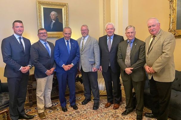 June 15, 2022: (L-R) MP John Finucane; CEO of Relatives for Justice Mark Thompson, Senator Chuck Schumer, AOH President Danny O\'Connell, TD Fergus O\'Dowd, AOH Freedom For All Ireland Chair Martin Galvin, and AOH Vice President Seán Pender.
