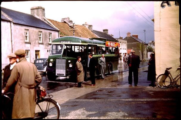 Tour bus from Galway to Cong and return, at a small-town stop, May 14, 1953. Taken in 1953 by the late Martin J. Walsh Jr. of Murdock, Minnesota.