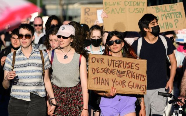 People march across the Hawthorne Bridge to protest the Supreme Court\'s decision to overturn Roe v. Wade on June 24, 2022, in Portland, Oregon. 