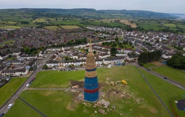 July 11, 2022: The completed Loyalist bonfire which is claiming a new world record in Larne, Northern Ireland. According to the official Guinness World Records, the record for the tallest structure stands at 198 feet and 11 inches, the Craigyhill bonfire has been measured at a height of 202.37208 ft by an independent land survey company.