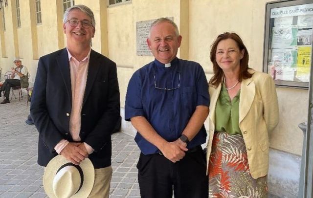 Ireland\'s Ambassador to France Niall Burgess, Monsignor Hugh Connolly, and Marie Burgess.