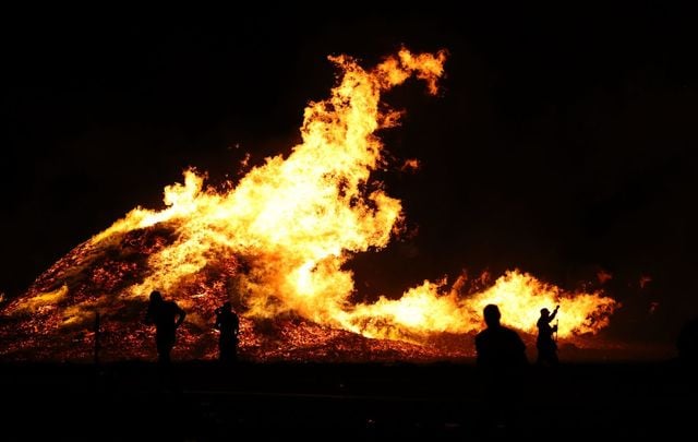 July 12, 2022: The Larne Bonfire after falling over on fire on the Eleventh Night or 11th Night referring to the night before the Twelfth of July.