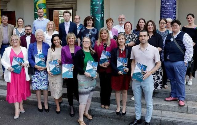 Members of the Gender Equality Committee alongside Dr Catherine Day and members of the Citizens\' Assembly on Gender Equality.