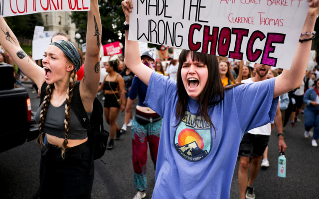 Casey Bryson participates in a protest against the Supreme Court\'s decision to overturn Roe v. Wade on June 24, 2022, in Denver, Colorado