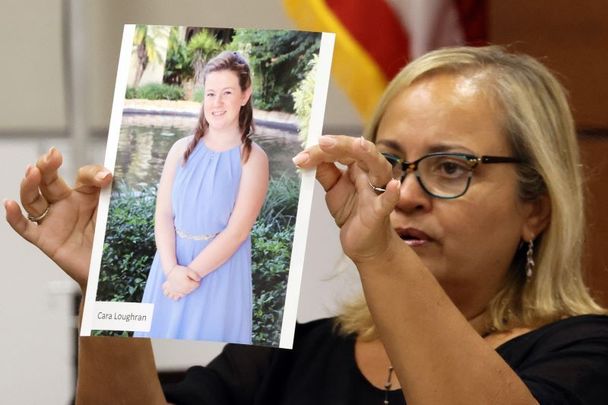 August 3, 2022:  Family friend Isabel Dalu holds a photograph of Cara Loughran before giving a victim impact statement on behalf of the Loughran family during the penalty phase in the trial of Marjory Stoneman Douglas shooter Nikolas Cruz at the Broward County Courthouse in Fort Lauderdale, Florida.