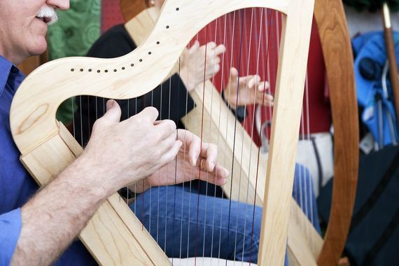 A harpist plays traditional Irish music.