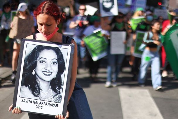 June 27, 2022: During a Los Angeles protest against the recent US Supreme Court decision to end federal abortion rights protections, an abortion rights supporter carries a photo of Savita Halappanavar, who died after being denied an abortion as she miscarried in Ireland in 2012.