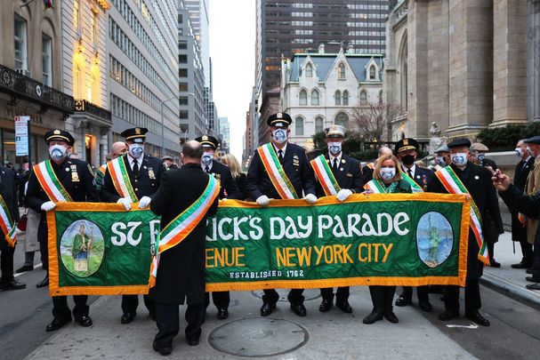 March 17, 2021: Parade marshals hold a banner after a short parade before the start of a St. Patrick\'s Day Mass at St. Patrick\'s Cathedral in Manhattan in New York City. The traditional St. Patrick\'s Day festivities in NYC were cancelled due to the coronavirus (COVID-19) pandemic.