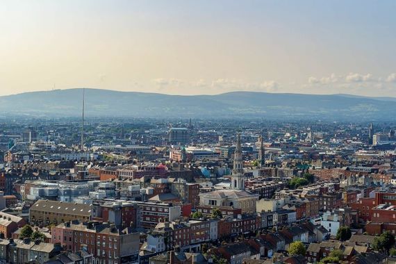 An aerial view of Dublin City and the distant Dublin Mountains. 