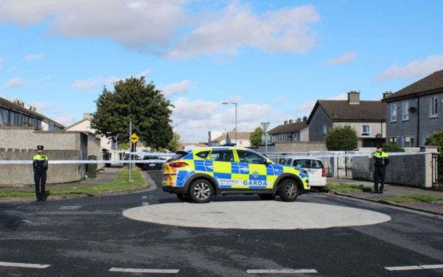 Gardaí at the scene while they are investigating an incident in Tallaght in which a teenager and her two young sisters died.