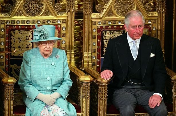 Queen Elizabeth II and Prince Charles, Prince of Wales are seated for the state opening of parliament at the Houses of Parliament on December 19, 2019 in London.