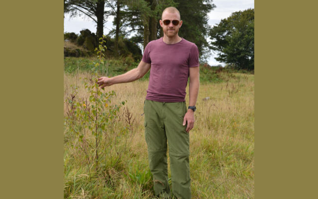 Tim Daly next to a newly planted Irish Heritage Tree on the farm in Co Cork