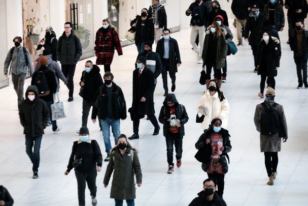 December 13, 2021: People wear masks at an indoor mall in The Oculus in lower Manhattan on the day that a mask mandate went into effect in New York City. 
